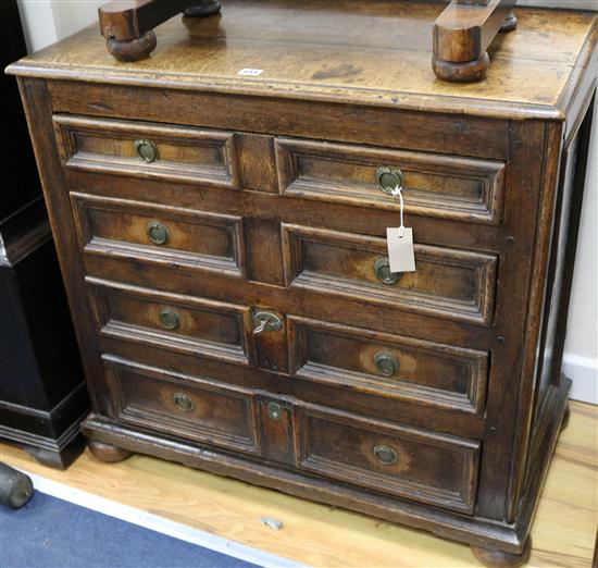 A 17th century style oak chest, W.84cm